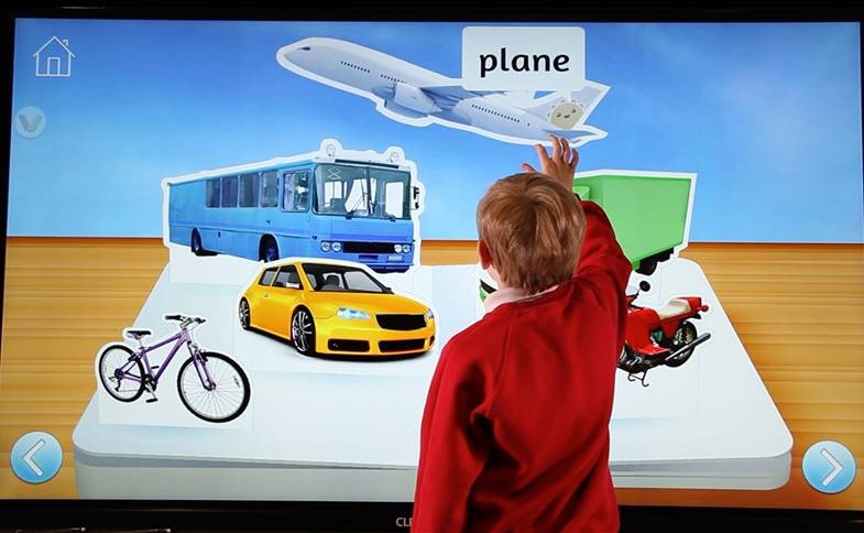 Child using cleverstore touch screen